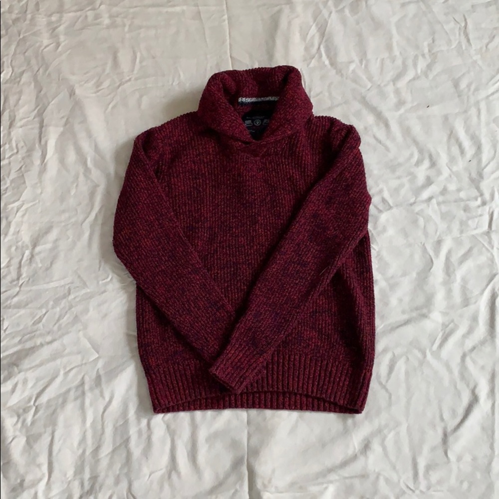 A maroon knitted sweater